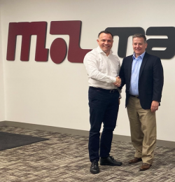 two men in business clothes shake hands