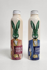 two metal bottles decorated with green rabbits wearing suits